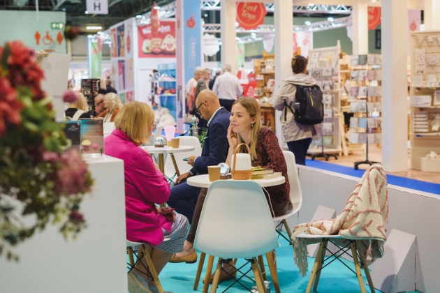 ladies having a meeting at a coffee table at a trade show